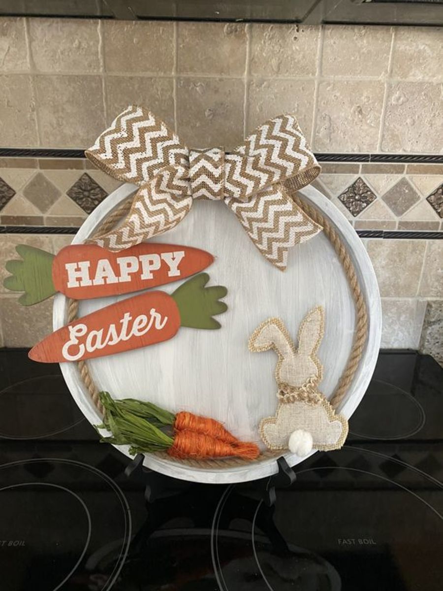This display piece combines jute carrots, wooden bunnies, ribbons, and more.