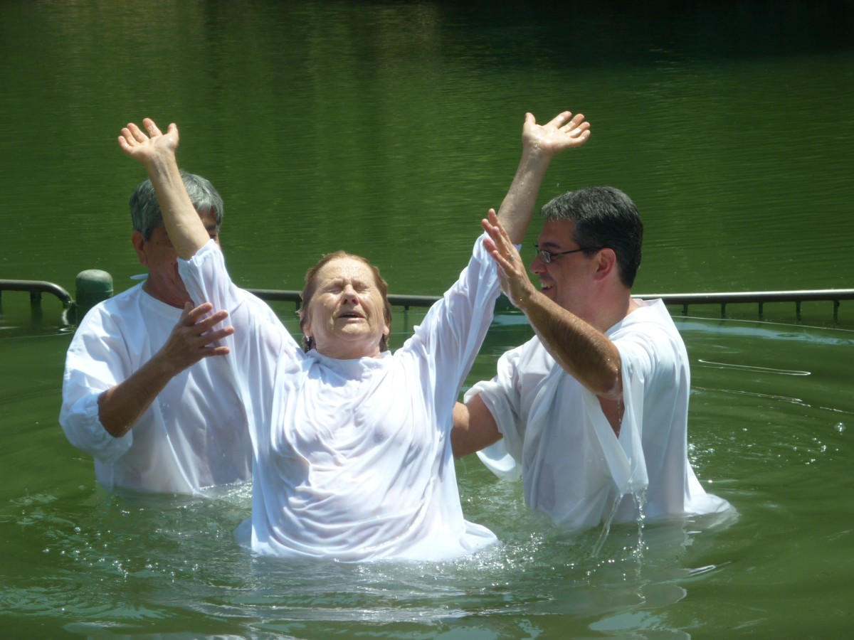 A Christian convert undergoing baptism in the Jordan River