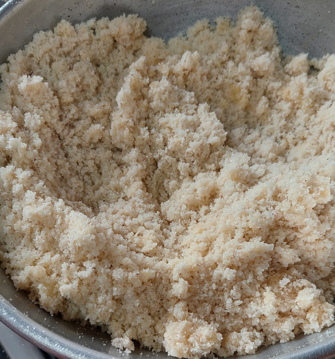 Add 2 tablespoons of ghee. Continue to fry mixture for 5 more minutes or until the rava starts to combine (add more ghee in between if the mixture becomes dry).