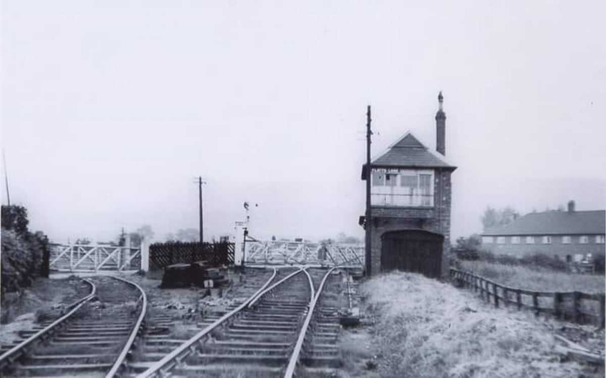 The junction and crossing seen from the west before closure. The left curve leads to a scrap dealer's yard, onward is Eston and to the right is the shortened line to the brick works