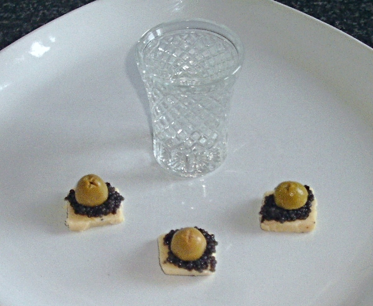 Caviar on truffle infused cheese with vodka shot