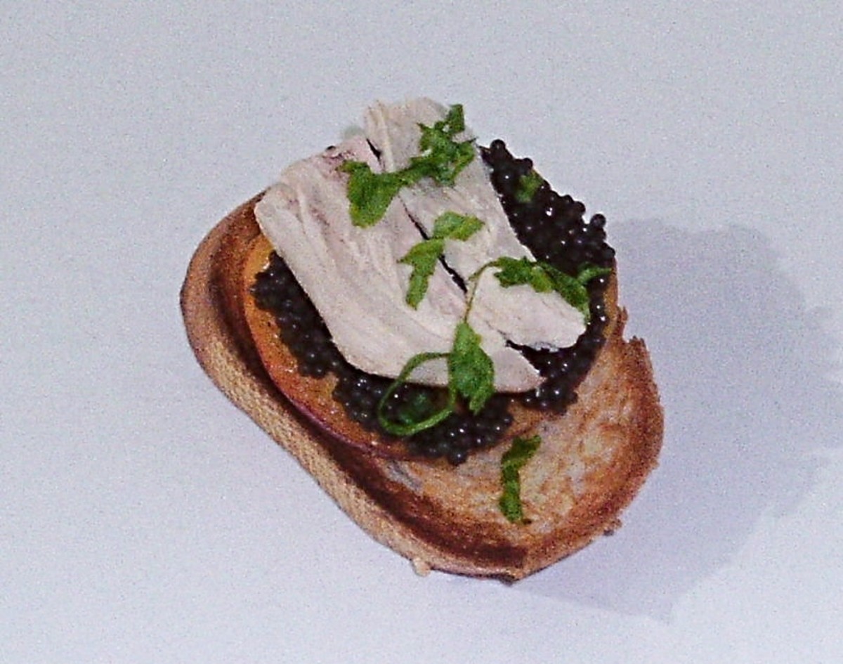 Caviar with peach and pheasant on toast