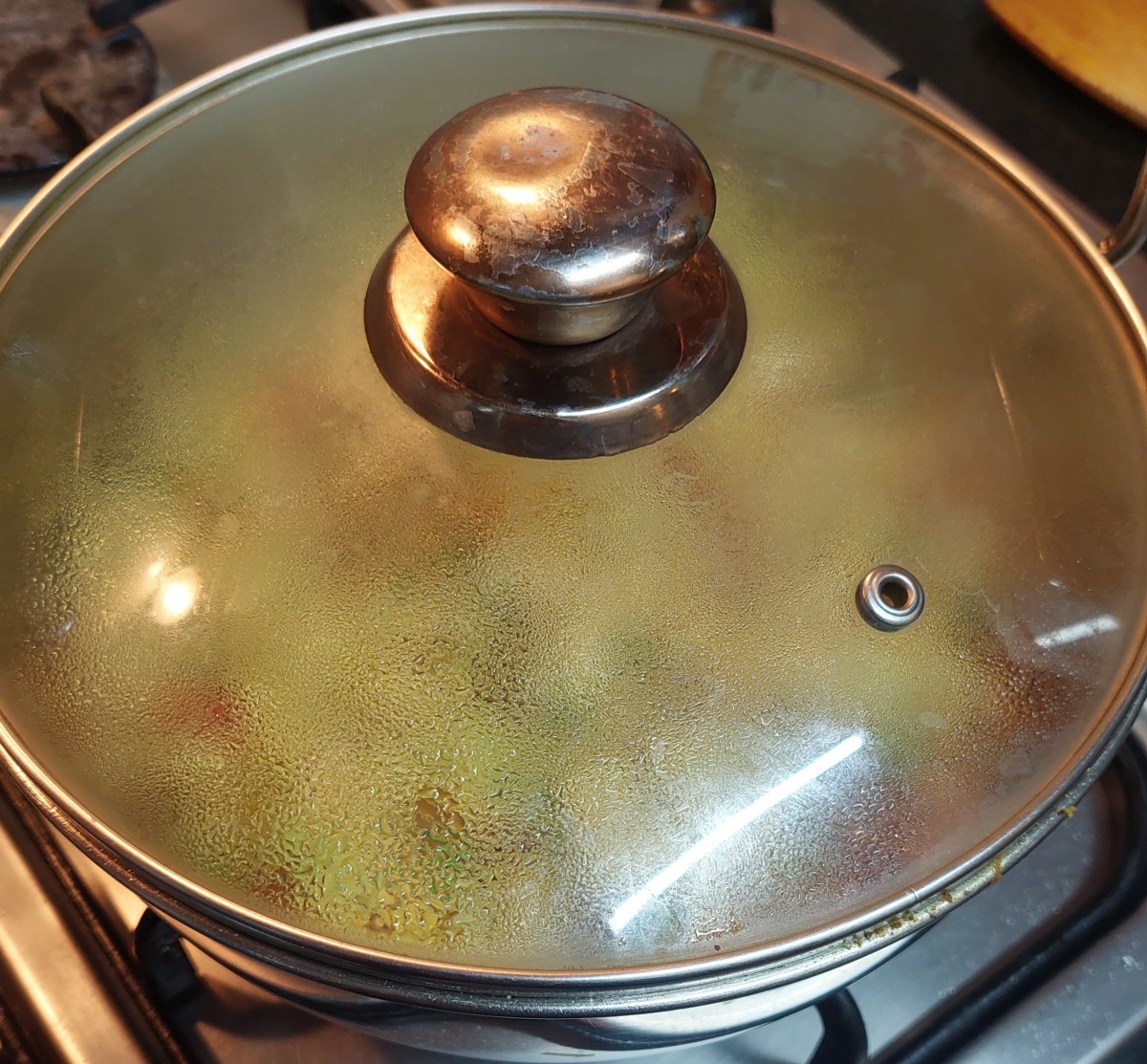 Close the lid and cook over medium flame, stirring occasionally.