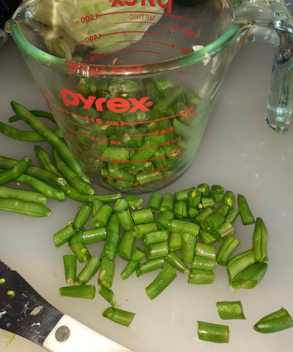 Uniform-sized bites of green beans. There is a satisfaction in hand-chopping to make a family meal.