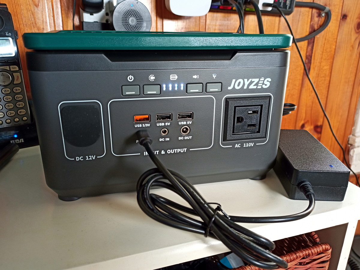 The power station is being charged using AC adapter connected to its PD 60W port