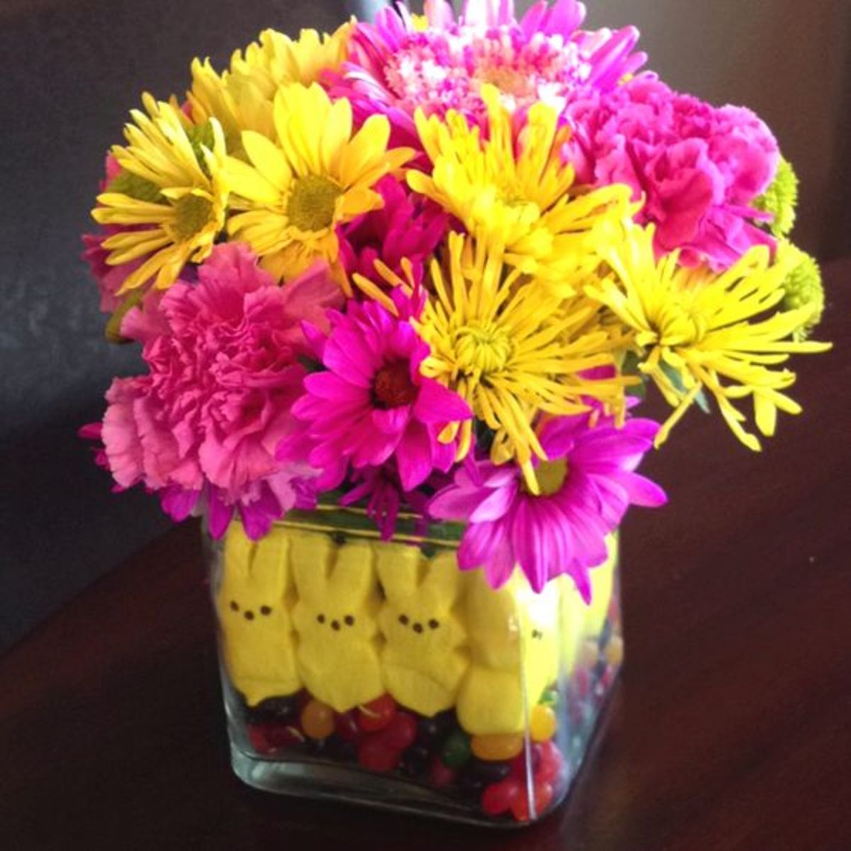 You can also mix colors—here, yellow Peeps peek out from beneath pink and yellow flowers.