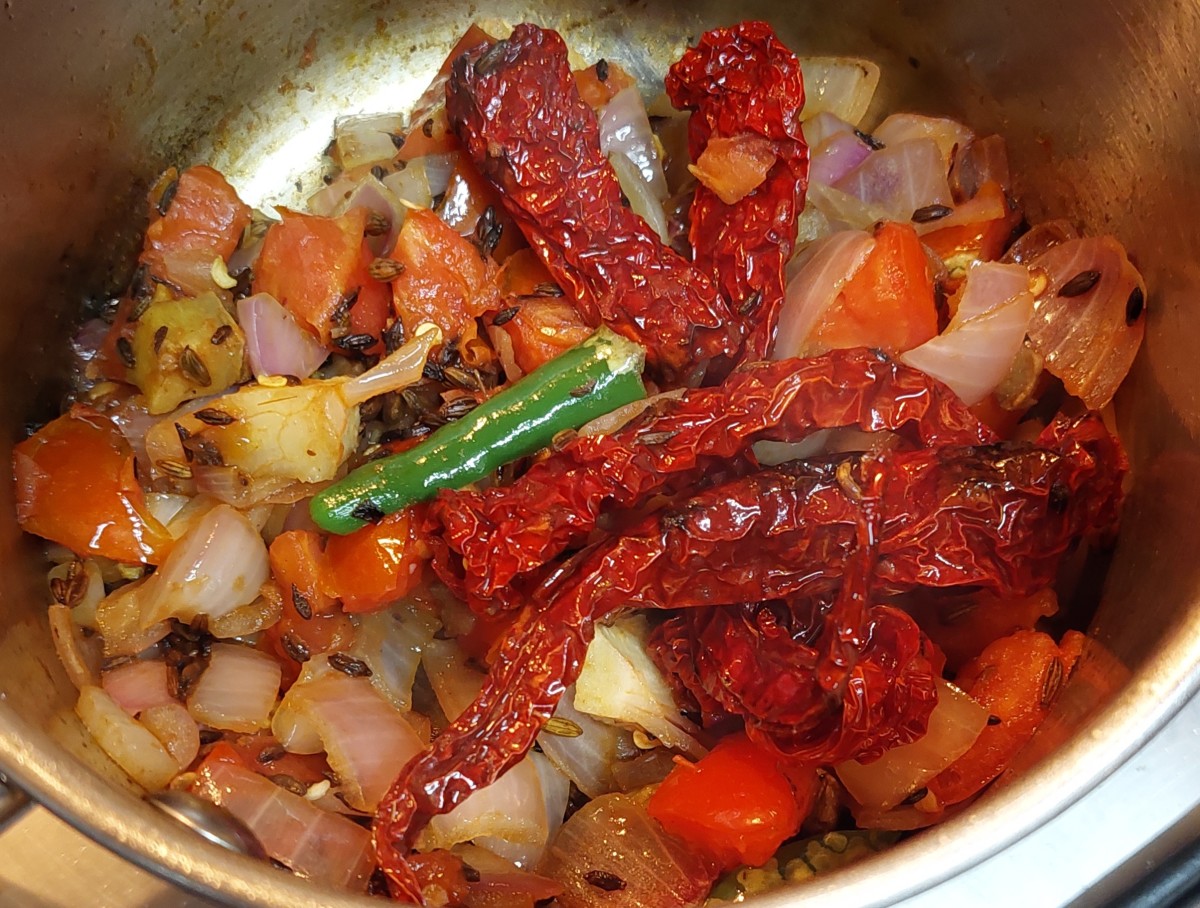 Add tomatoes and fry till they shrink. Switch off the flame and let the mixture cool down.