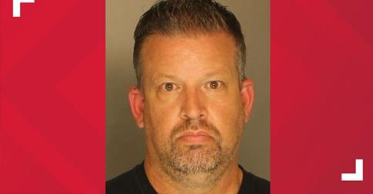 Elementary school teacher Chad Gerrick, age 50, threatened to shoot school officials for removing the clear plastic Covid barrier located in front of his classroom desk.