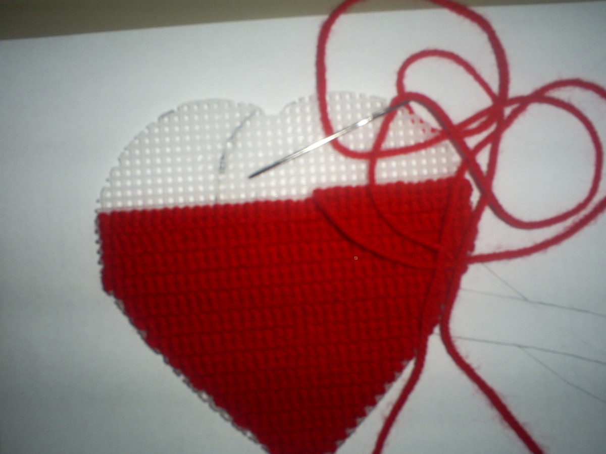Here the cross stitched heart is three-fourths completed.