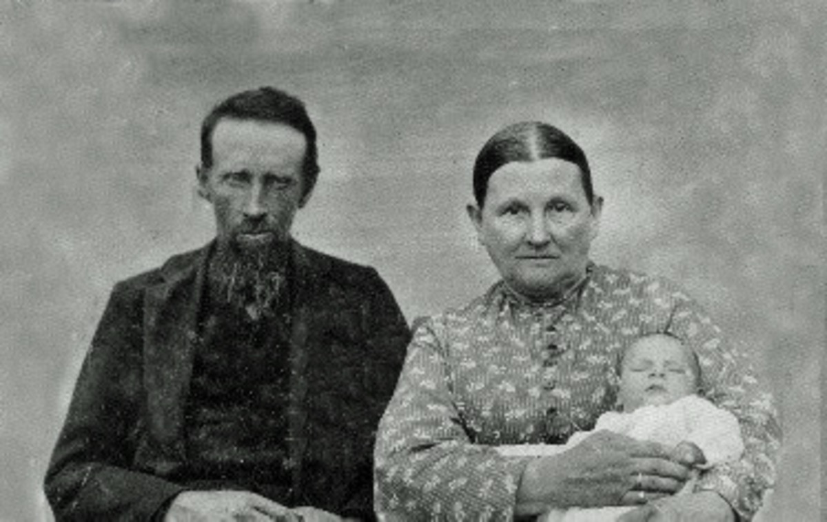 Abraham Tower and his wife Nancy Angeline (Long). She is holding one of their grandchildren. 