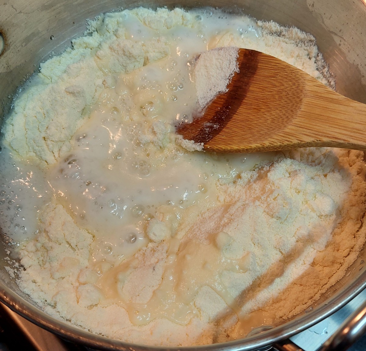 Add 1 1/2 cups of milk powder. Mix until well combined with the sugar solution (no lumps).