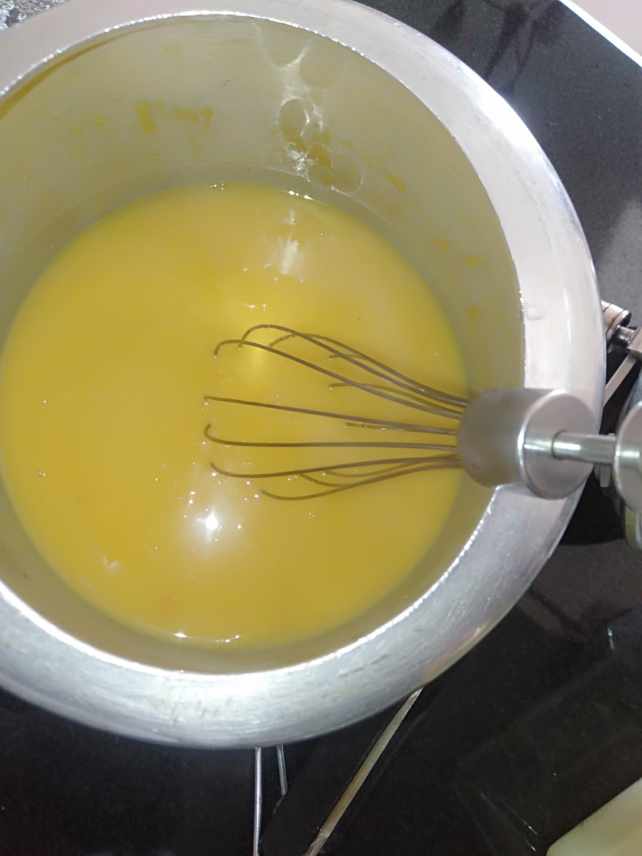 Open the pressure cooker and whisk the dal.