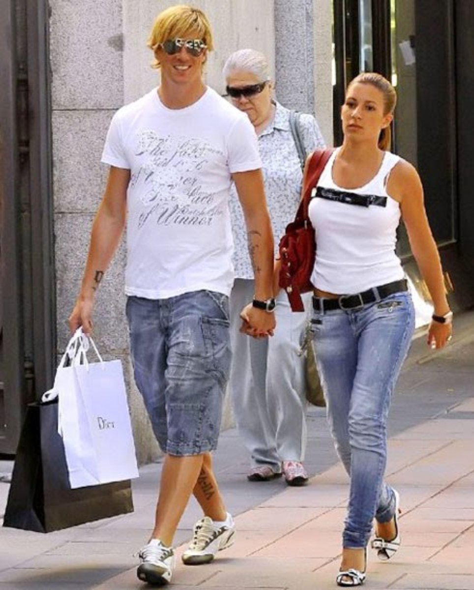 Fernando Torres and Olalla Dominguez  in white t-shirt and sleeveless top
