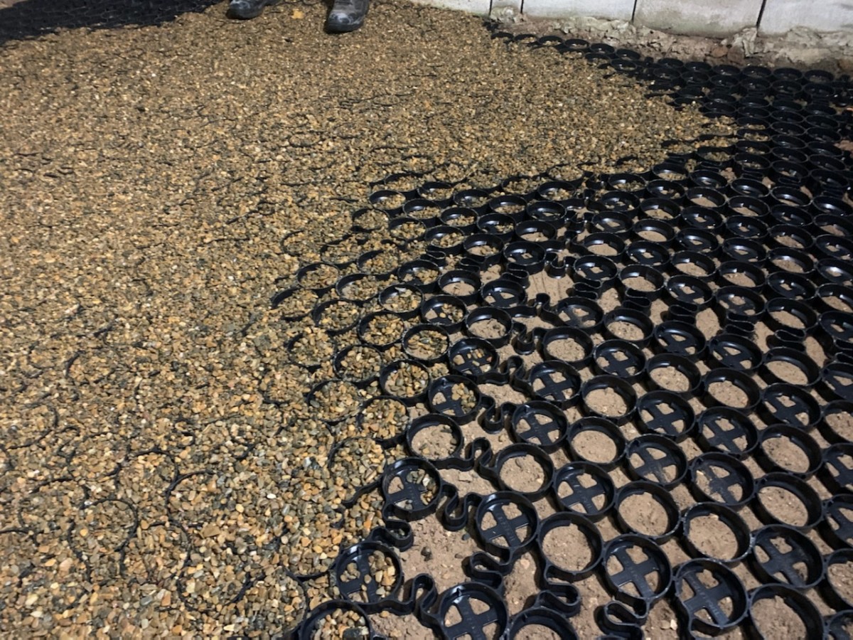 Spreading gravel across the grid was like working a really big zen sand garden. Here, you can see it spread over a small section of the porch floor area.