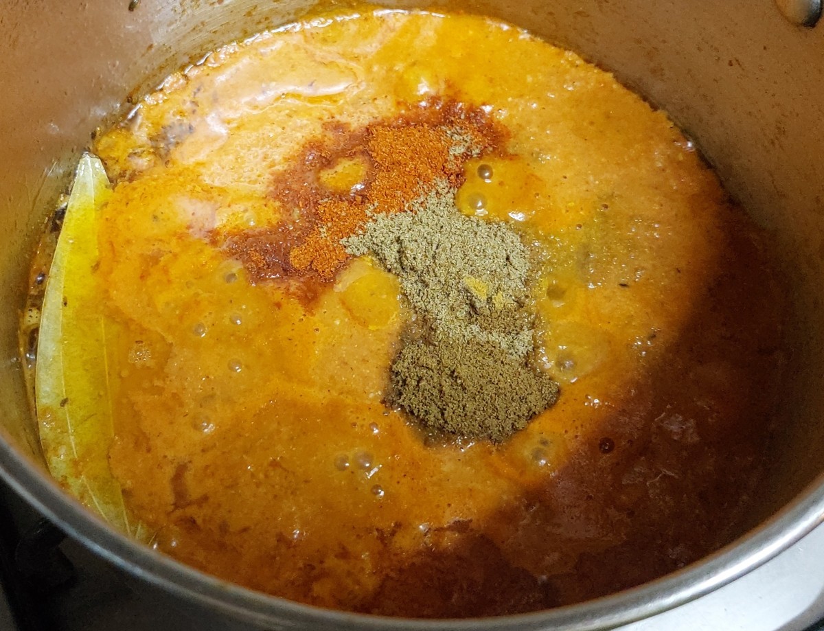 Add 1/2 teaspoon of turmeric powder, 1-2 teaspoons of red chili powder, 1 tablespoon of coriander powder and 1 teaspoon of cumin powder. Mix well and cook over low flame for 2-3 minutes.