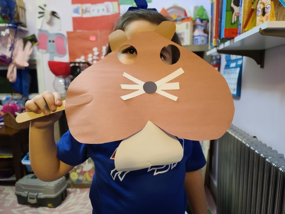 This cute groundhog mask can be made out of construction paper and a craft stick.  