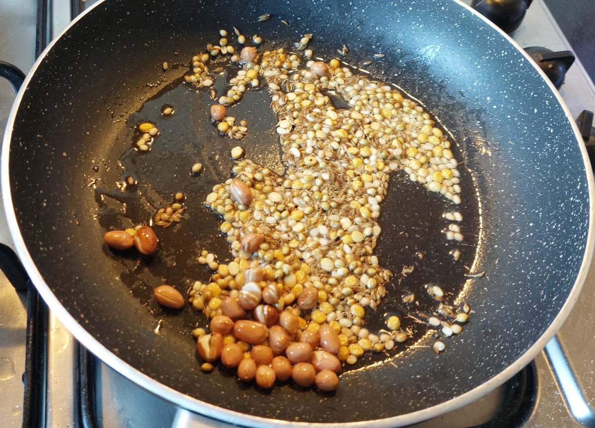 Add 1 tablespoon coriander seeds, 1 teaspoon of cumin seeds and fry for a minute or till color turns brown.