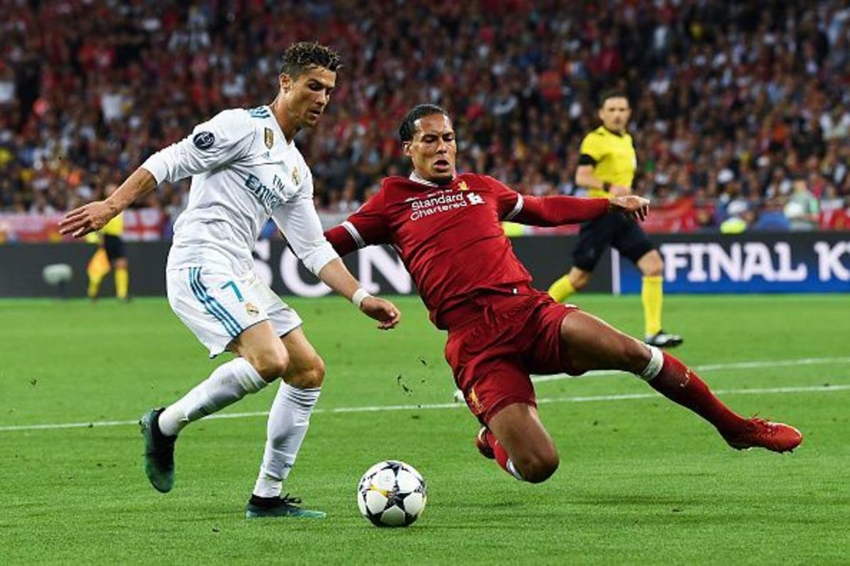 Liverpool Fc's Virgil Van Dijk (right) tackling Real Madrid's Cristiano Ronaldo (Left) during the 2018 Champions League Final. 
