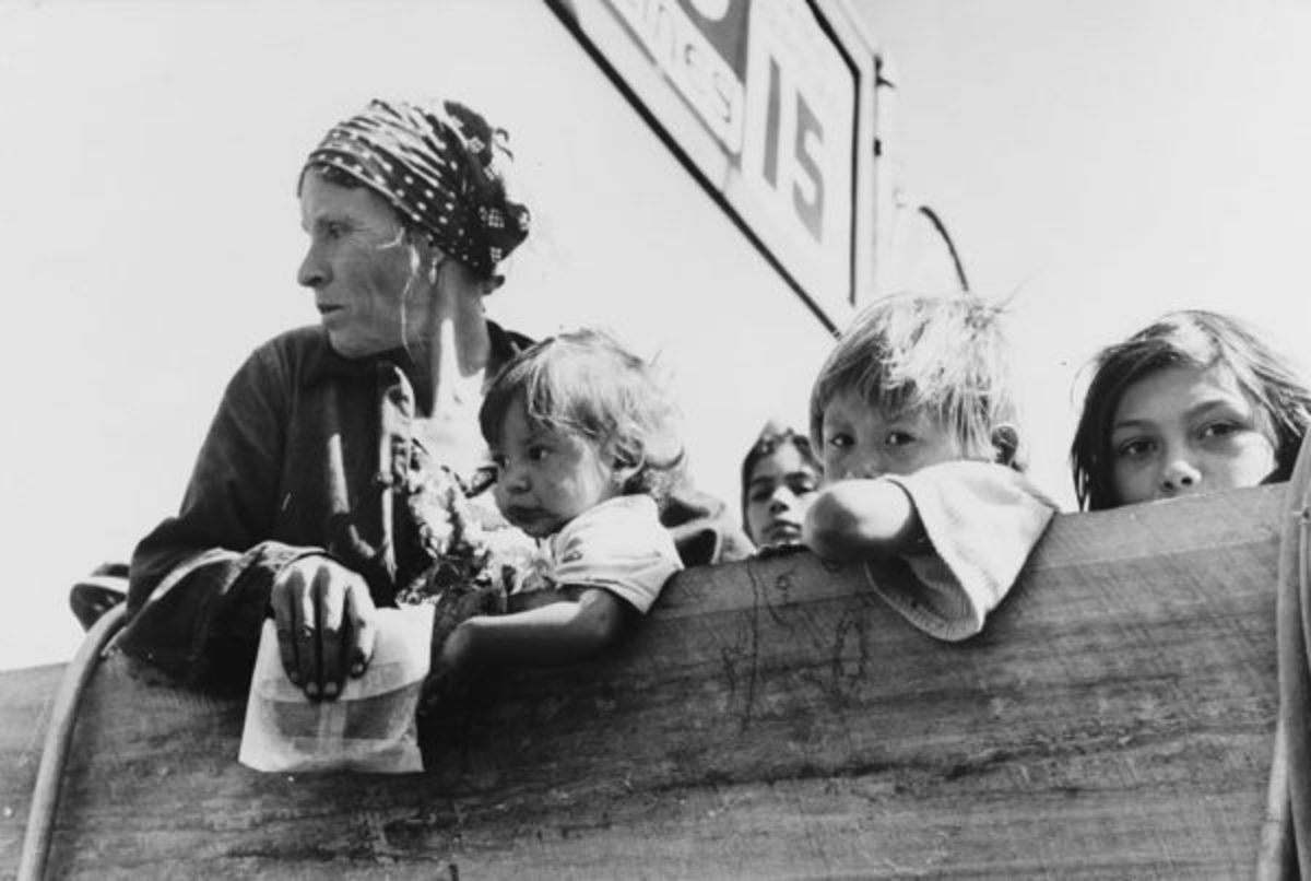 A Mexican woman and children on a truck bound for Mexico.