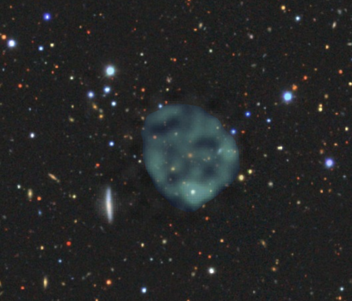 ORC 1 with a potentially related orange galaxy in the center.