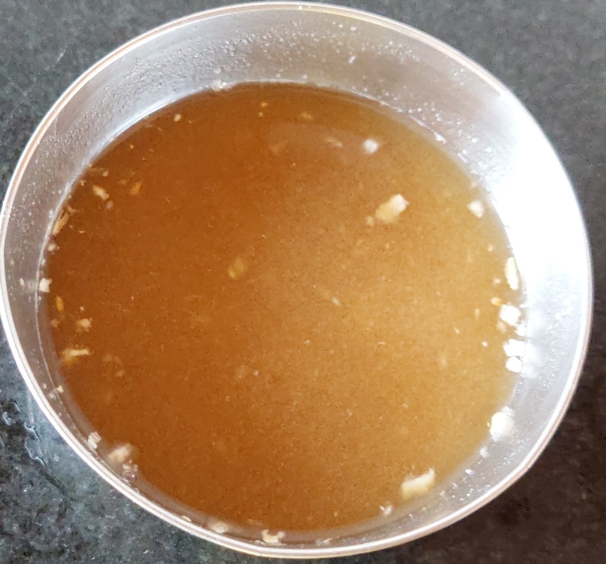 Squeeze tamarind water and discard the residue. Keep tamarind water aside.