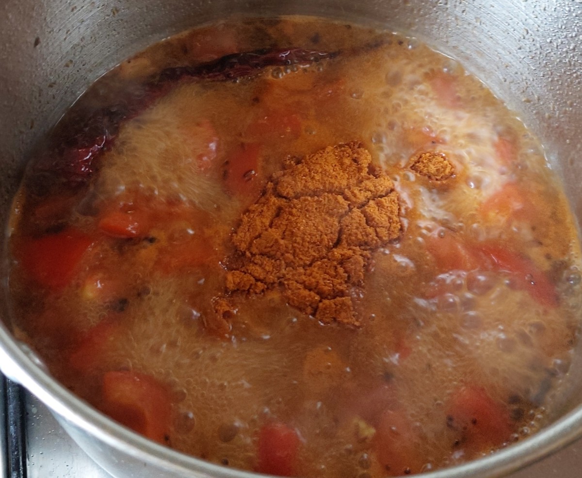 Add 2 tablespoons of sambar powder, mix well and cook till raw smell of powder goes away.