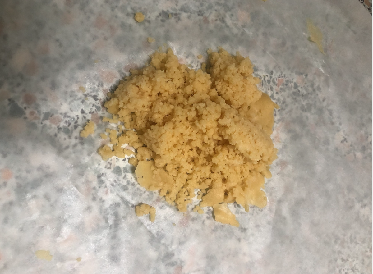 A few tablespoons of the crumbed mix on a sheet of baking paper