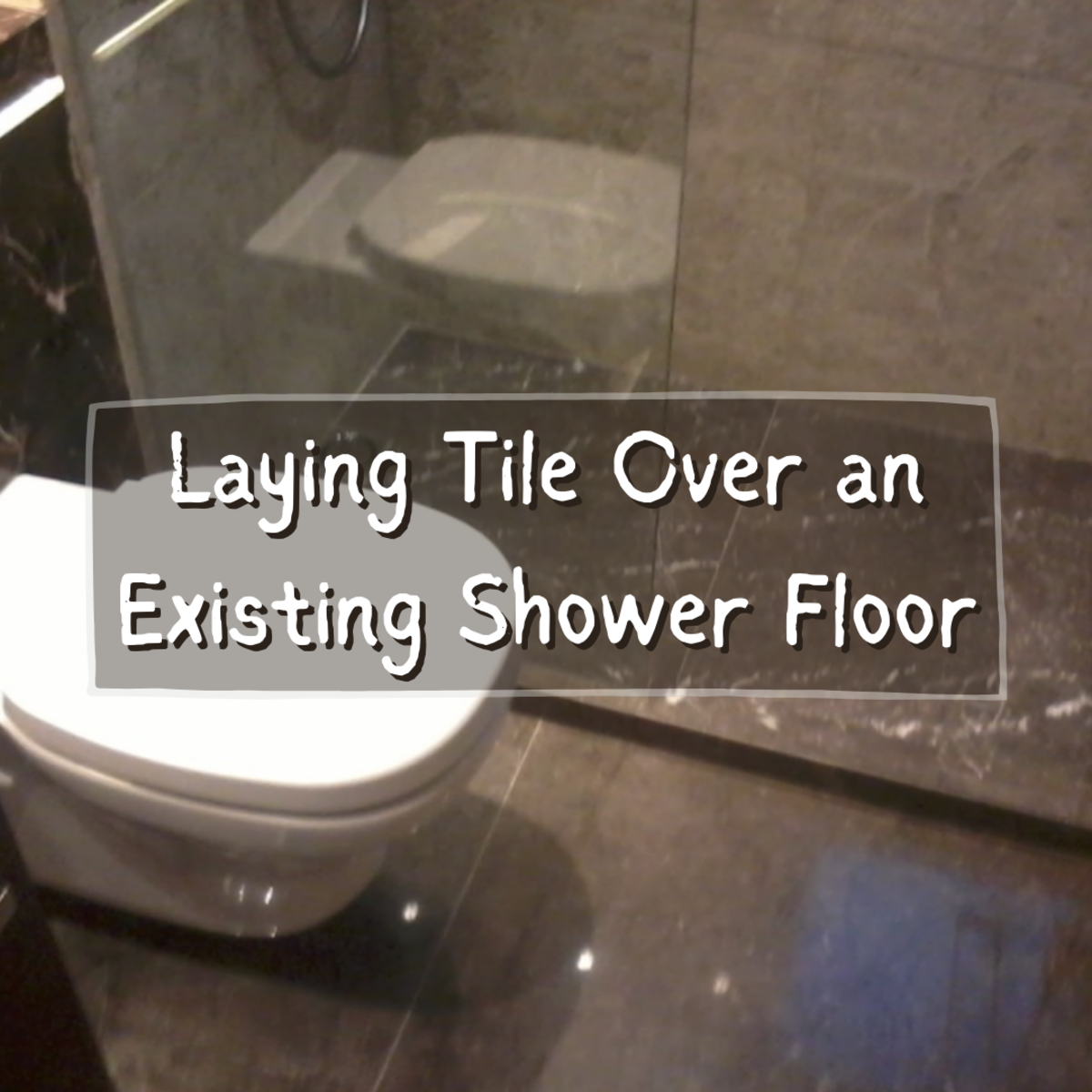 Read on to learn how to tile over an existing shower floor! A new tile shower floor helped transform this common bathroom into a work of art.