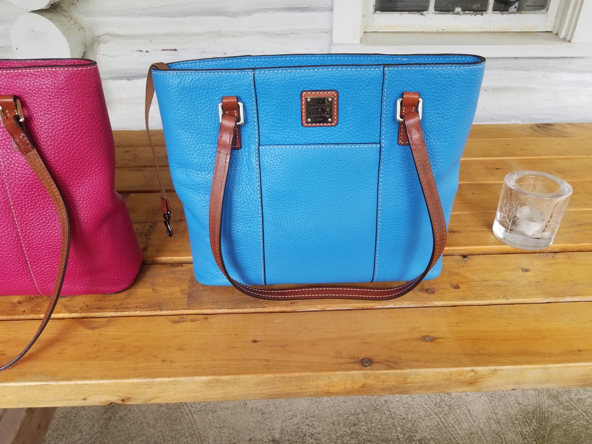 Suddenly the blue bag looked new, and whenever I set it down, like under a table, it stays upright, and therefore cleaner. Totes and bags with feet should be healthy enough to stand!