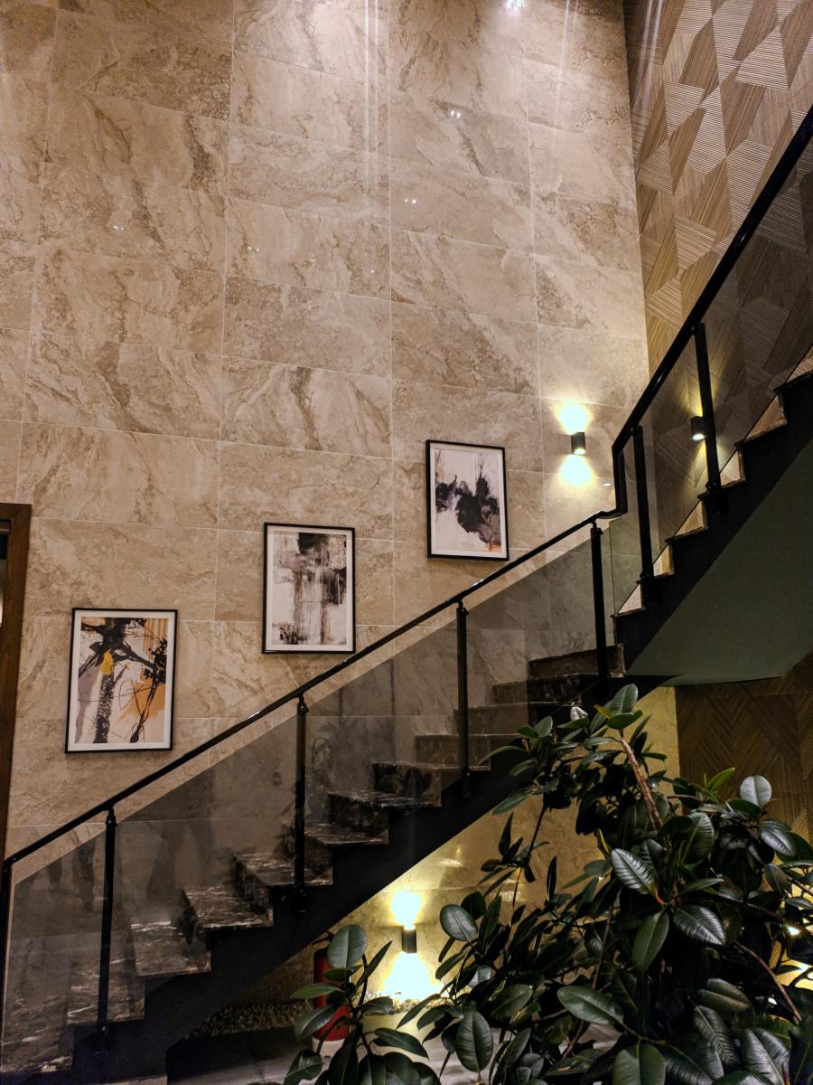 The staircase is a great place to display pictures. 