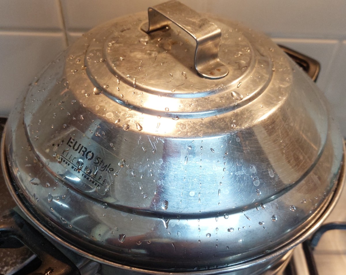 Keep in the idli maker. Close the lid and steam for 20 minutes in high flame.