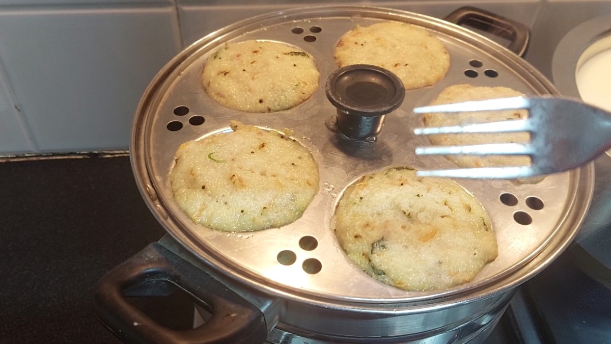  Insert the fork or spoon in the idli to check if it is done. If the fork or spoon came out clean (without batter sticking in it) it is done. Switch off the flame.