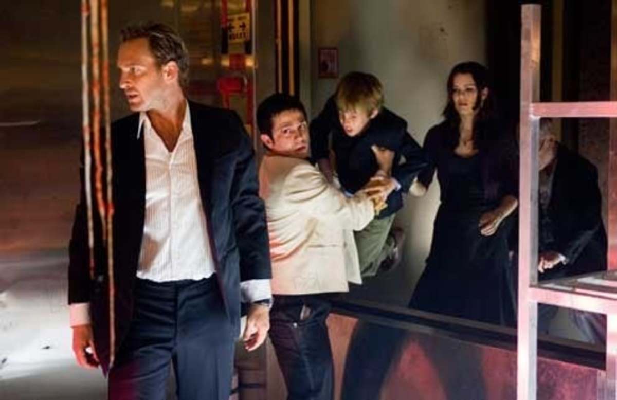Conor (Jimmy Bennett) gets a lift from Valentin (Freddy Rodriguez) as Dylan (Josh Lucas) leads the survivors, followed by Maggie (Jacinda Barrett) Conor's mother