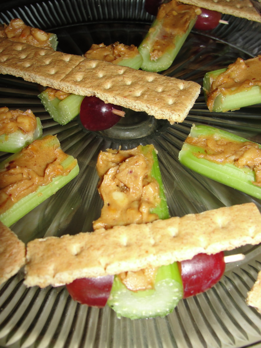 Airplanes made from celery sticks, peanut butter, grapes, and graham crackers