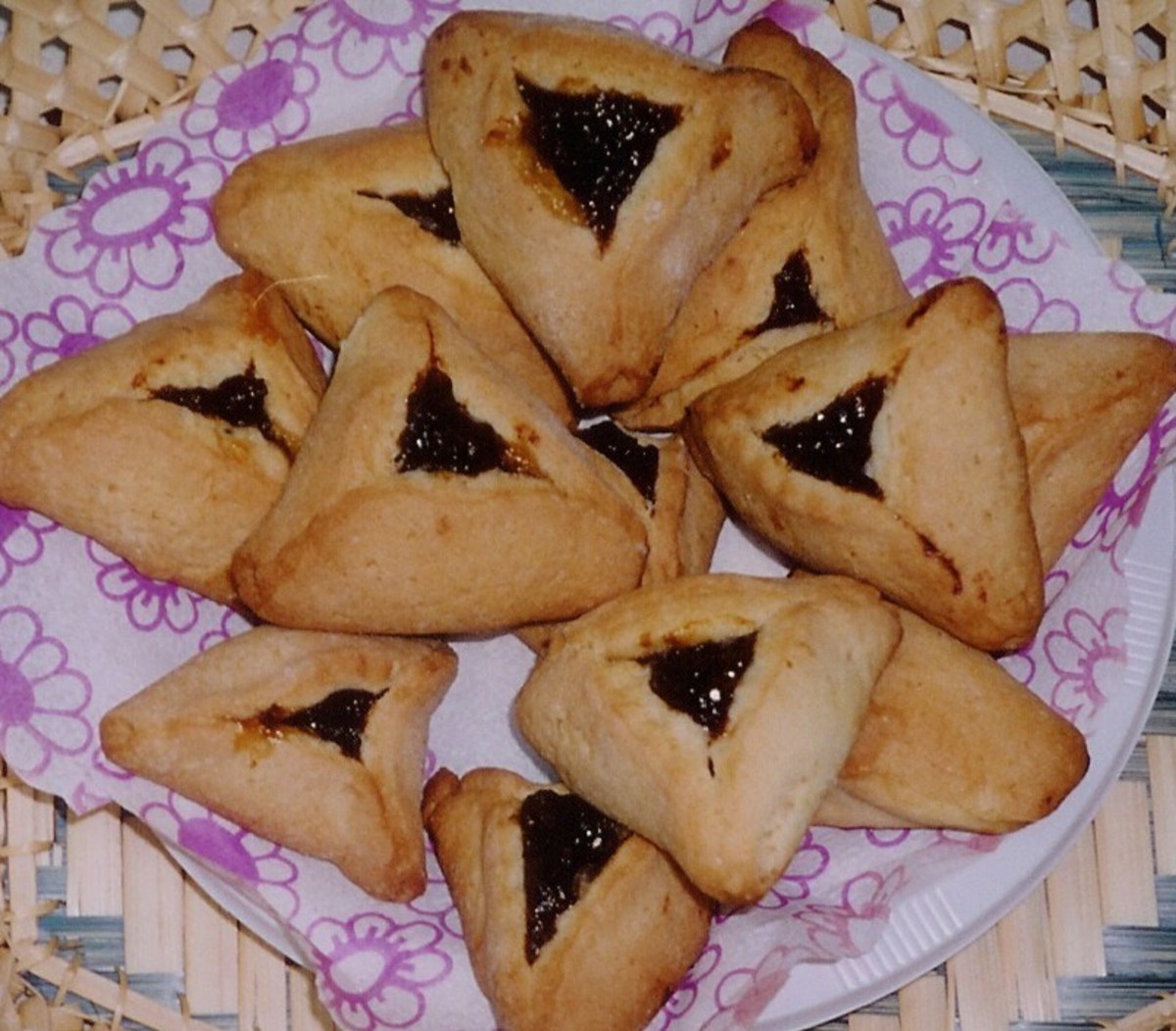 Jam-filled pastry cookies called Hamantaschen .  They are eaten at the holiday of Purim.