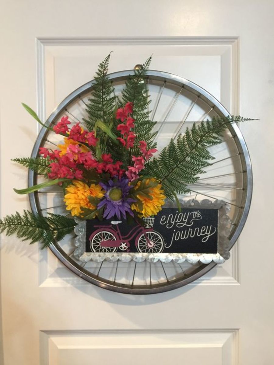 Before you discard your old bicycle wheels, consider repurposing them for some beautiful home decor!