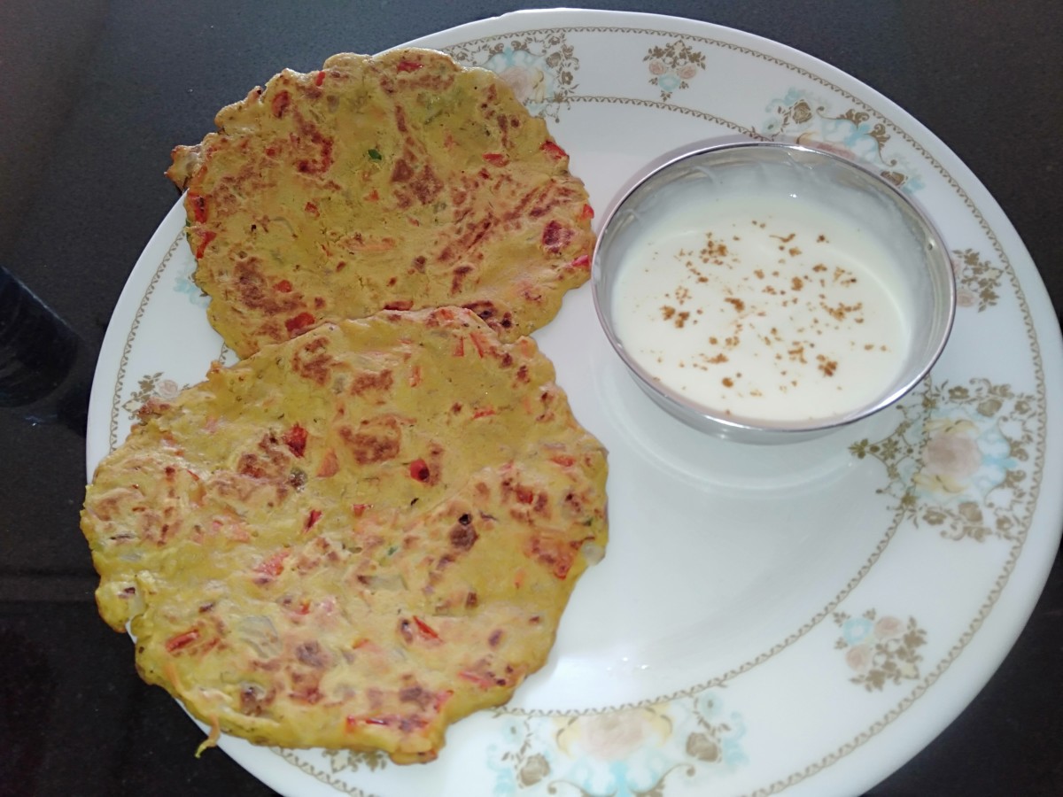 Oat and vegetable chilla served with curd