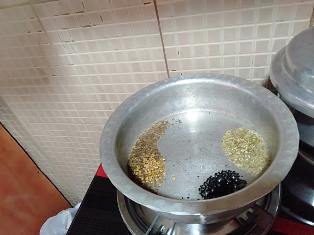 Heat 3 tablespoon oil in a cooking pot. Keep the flame low. To it, add cumin seeds, fennel seeds, fenugreek seeds and nigella seeds. Sauté well until cumin seeds turn golden brown.