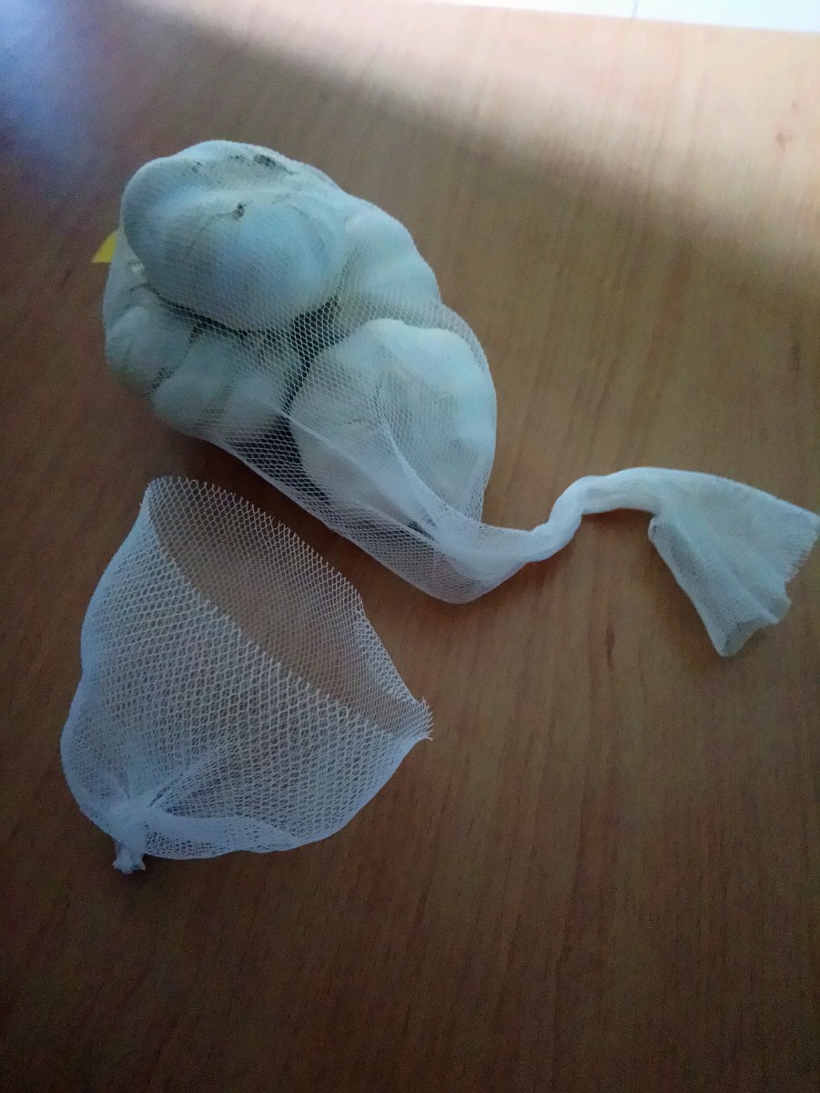 DIY filter - cut off part of a garlic netting bag and tie a knot at one end.