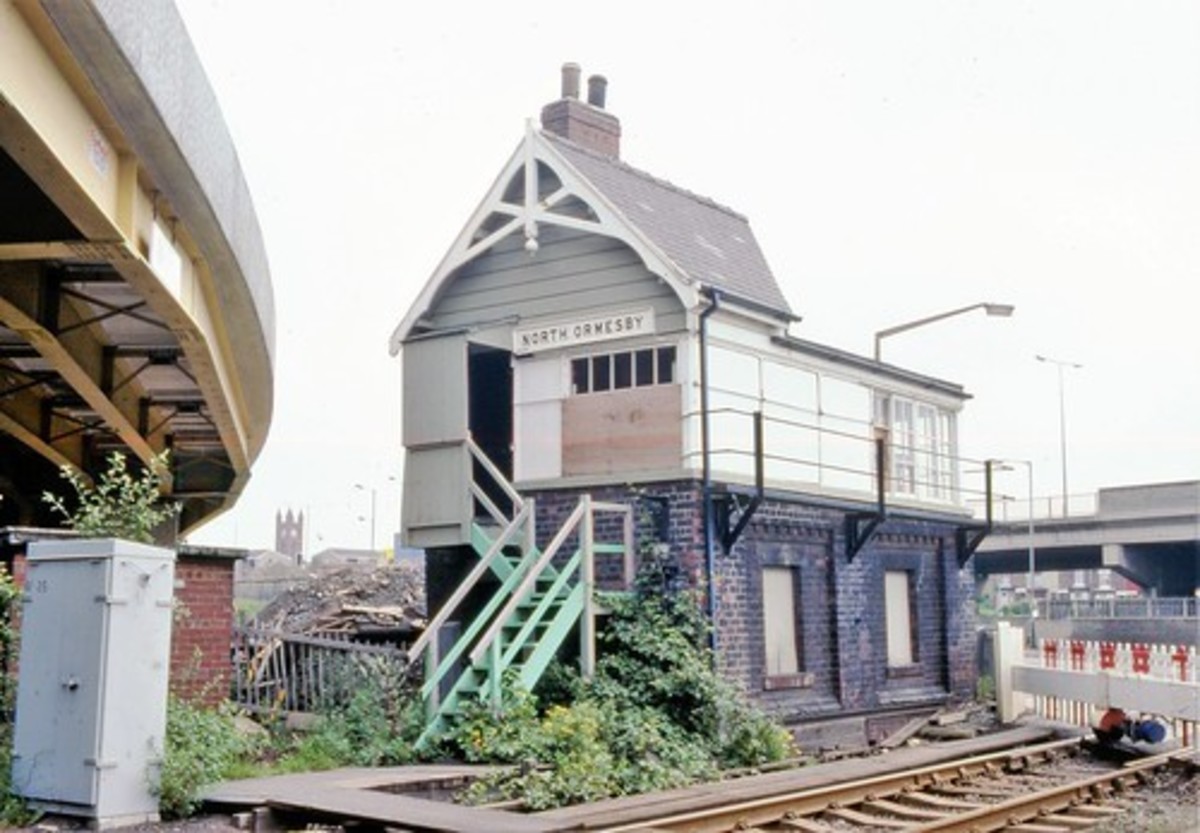 This was North Ormesby level crossing near Middlesbrough, where a skewed footbridge had been built across half the width of the signal cabin, and taken down before final demolition. (North Eastern Railway Type C1)