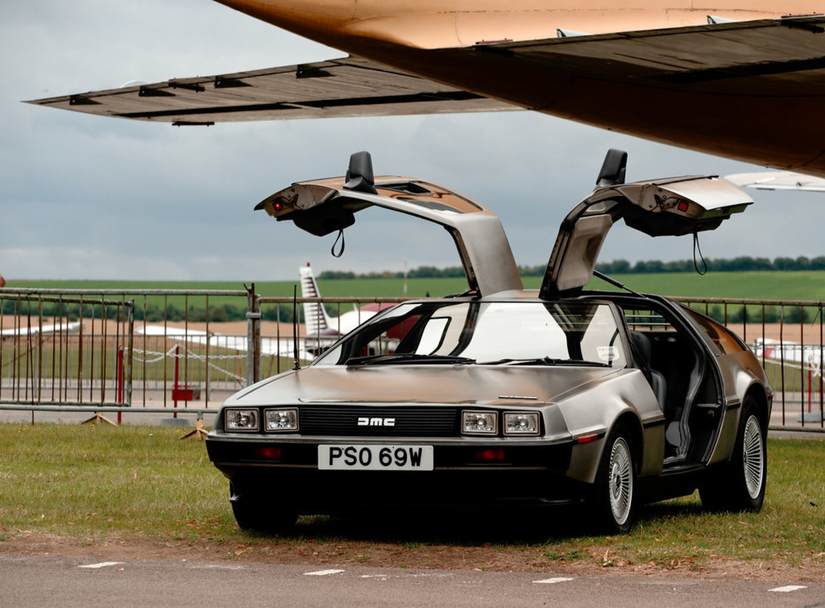 DeLorean with iconic gull-winged door open. 