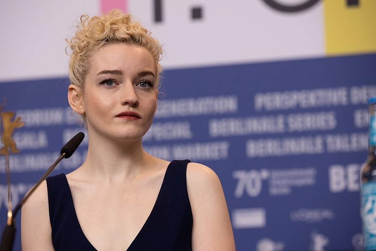 Is Anna Delvey a real person? Julia Garner portrays Anna Sorokin, the woman reported to have used the identity Anna Delvey, in the 2022 Netflix series "Inventing Anna."