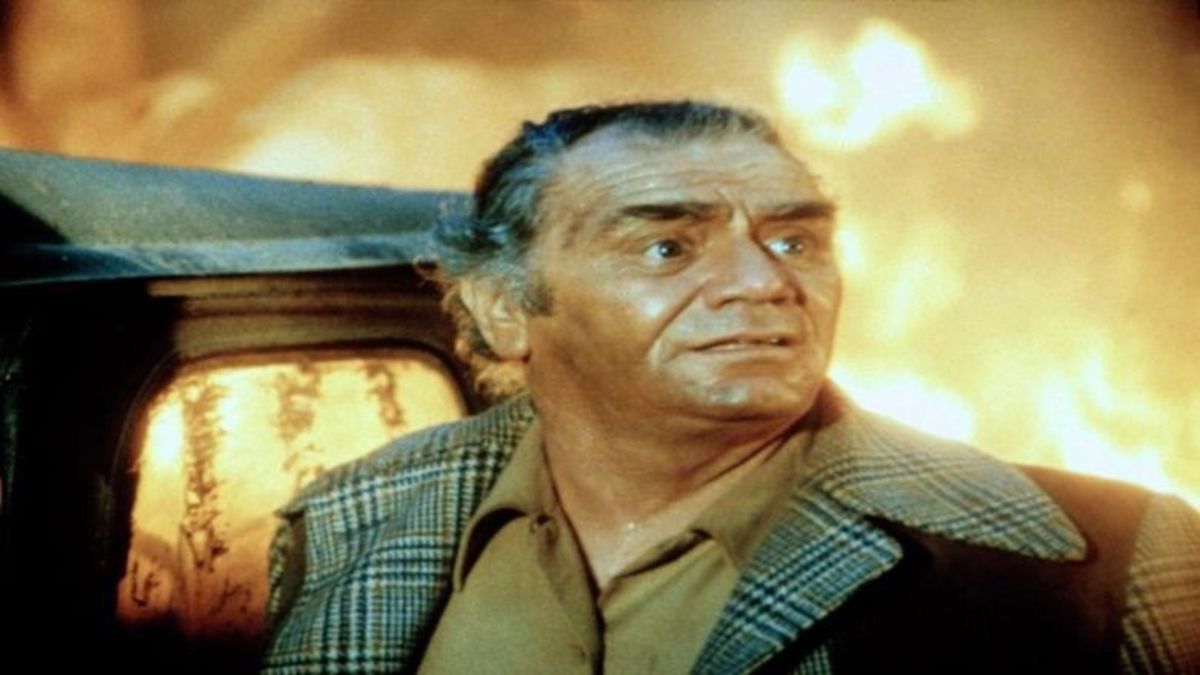 Sam Brisbane (Ernest Borgnine) has to figure a way out of the fire surrounding him