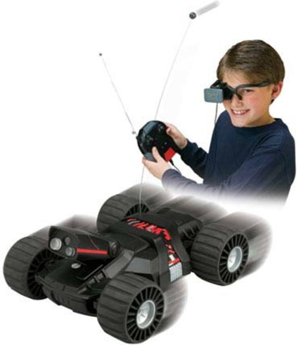 A kid playing with a remote-controlled robo car. 