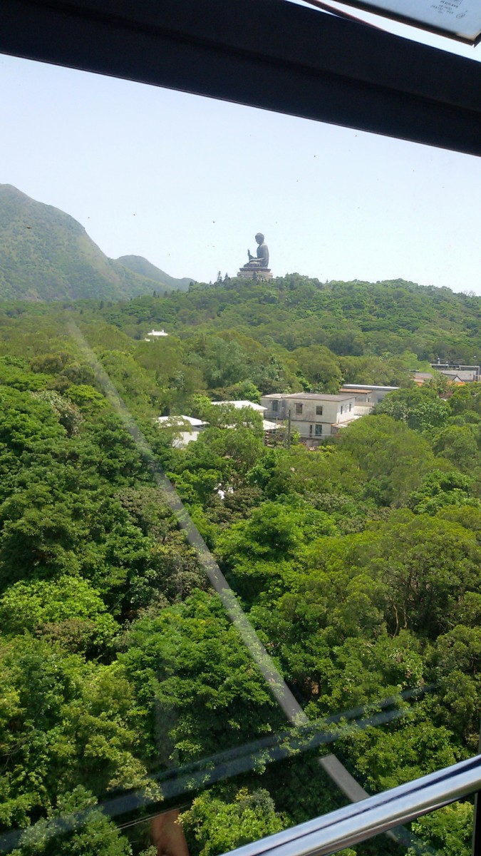 Giant Buddha statue as viewed from a cable car headed toward Ngong Ping Village