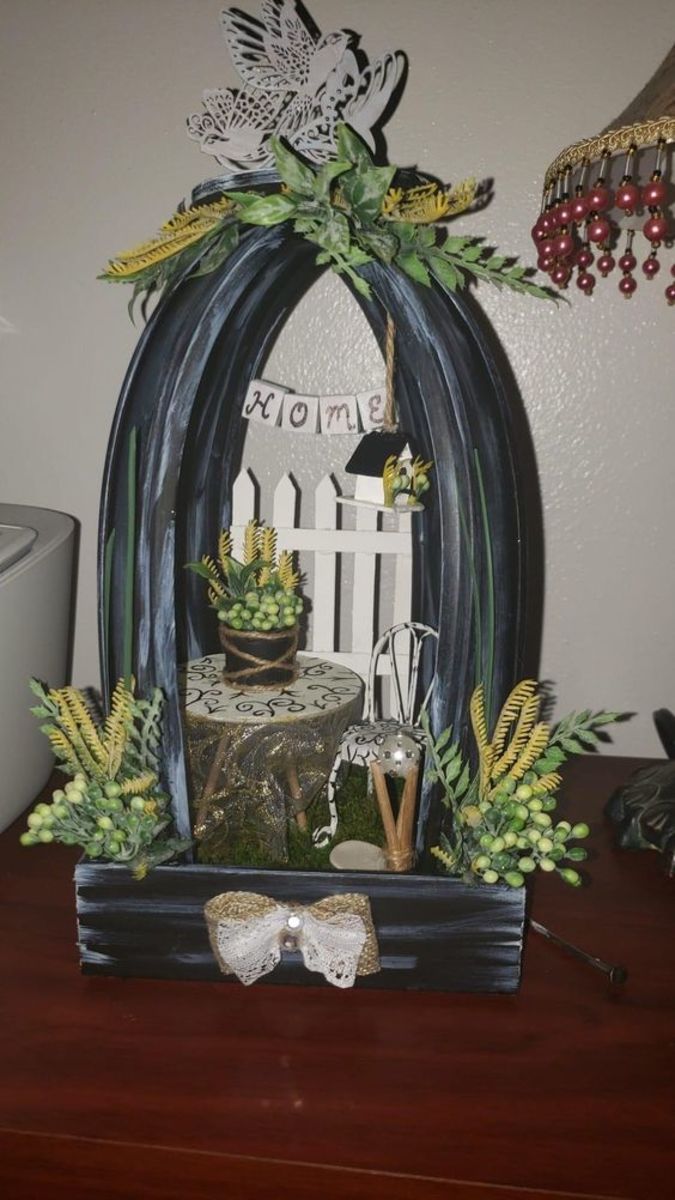 Create a miniature scene in your arched lantern.