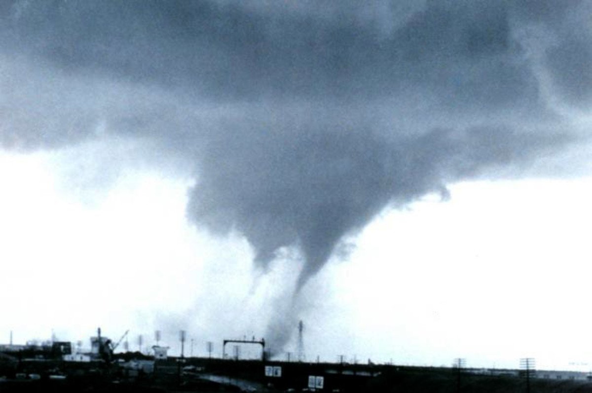 A multiple-vortex tornado is a type of tornado in which two or more columns of spinning air rotate around a common center (photo from wikipedia)