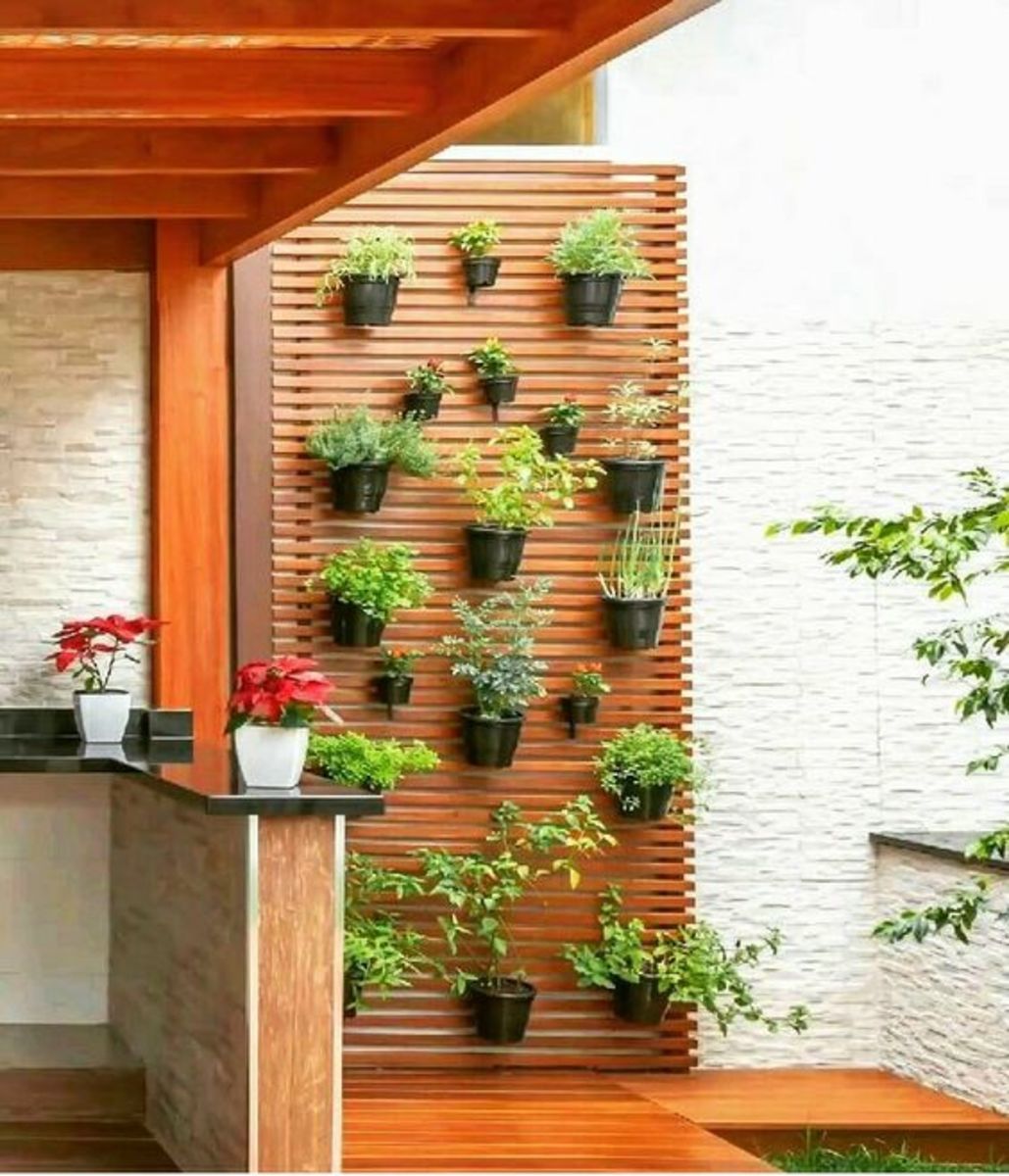 A bright wall garden is an attractive, innovative, and foremost front yard feature. 