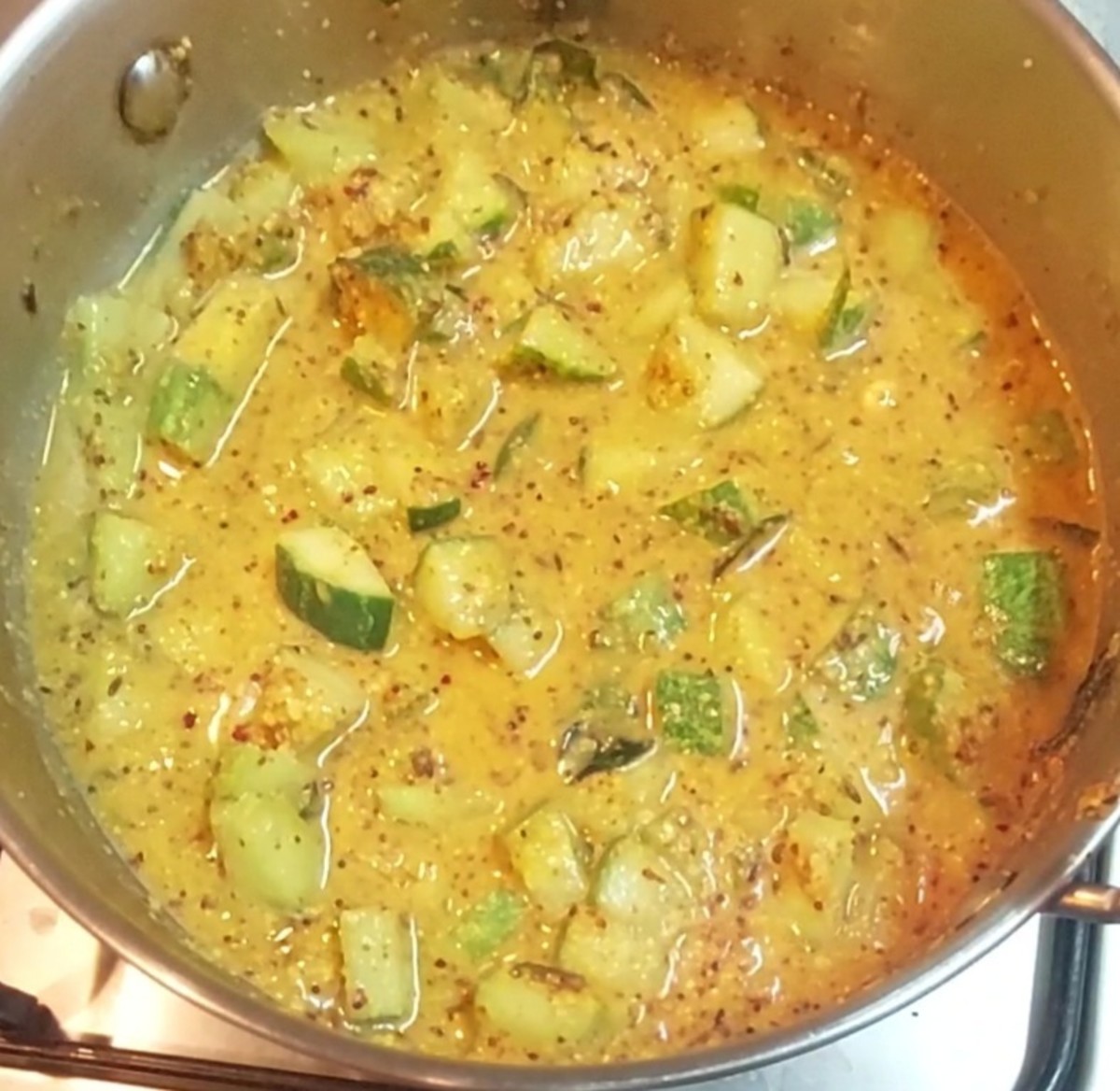 Add 1 cup of water, give a mix, close the lid and cook well till cucumber is cooked. Add more water in between if required.