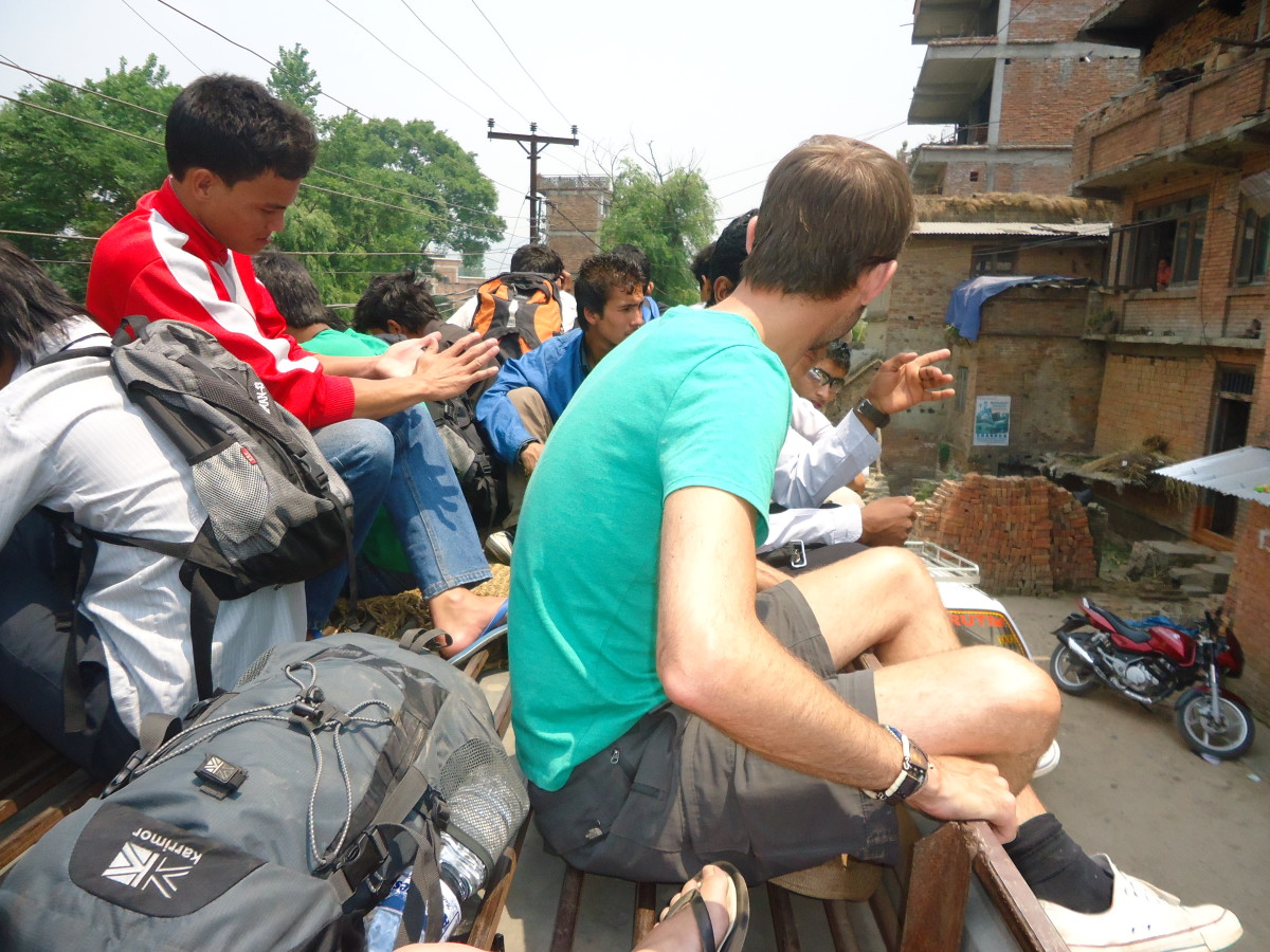 Learning about Nepali life whilst travelling in the roof of a bus outside Kathmandu